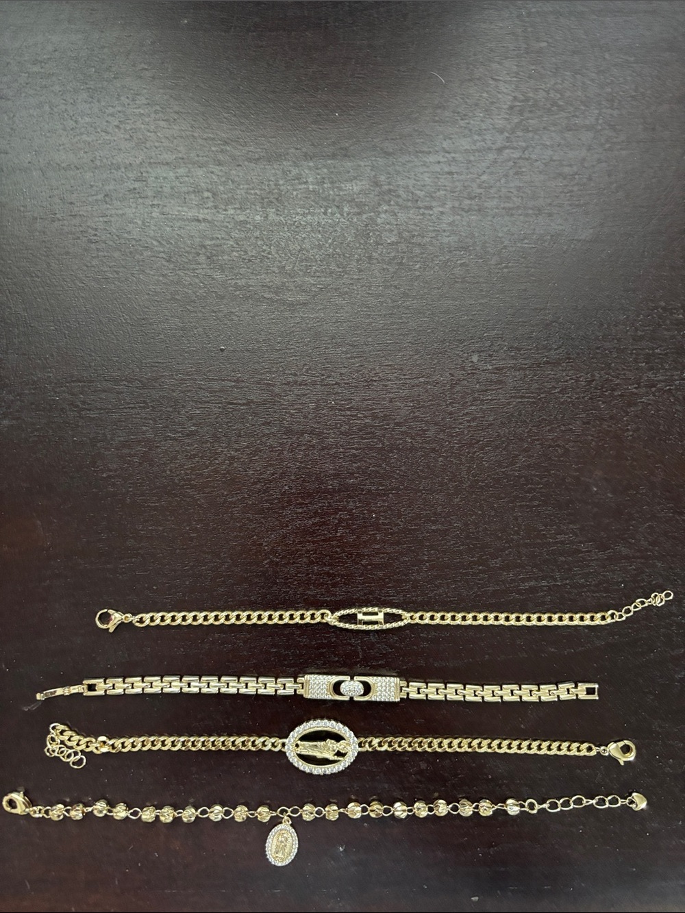 Pretty Bird jewelry Gold toned bracelets set of 4